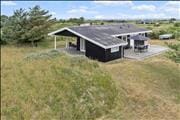 Flot sommerhus med naturskøn beliggenhed
