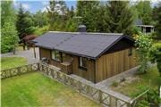 Velindrettet og hyggeligt sommerhus i naturskønt sommerhusområde ved Helberskov