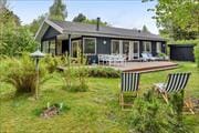 Dejligt sommerhus beliggende på hyggelig grund med mulighed for diverse aktiviteter
