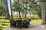 In the deep quiet of the Ulvshale forest, you will find this beautiful summer house, with a view over the Møn bridge.