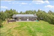 Hyggeligt og lyst indrettet sommerhus ved Thorup Strand